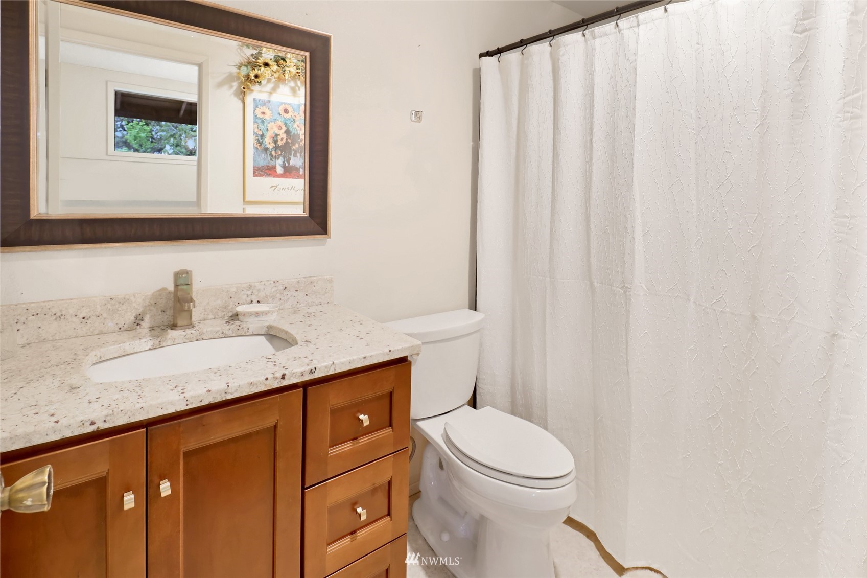 201 Middlefield Road Bellingham, WA 98225 - Photo 29 of 36 a bathroom with a granite countertop sink and a mirror