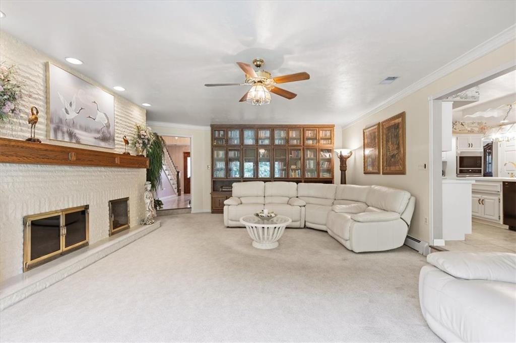 18 Timbercrest Circle Cecil, PA 15321 - Photo 14 of 48 a living room with furniture a fireplace and a chandelier