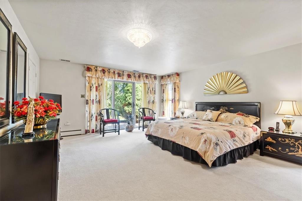 18 Timbercrest Circle Cecil, PA 15321 - Photo 20 of 48 a spacious bedroom with a bed and a chandelier