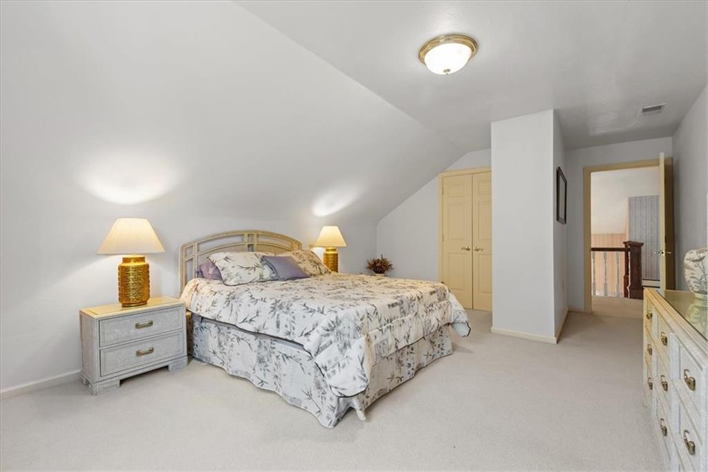 18 Timbercrest Circle Cecil, PA 15321 - Photo 30 of 48 a spacious bedroom with a bed and a lamp