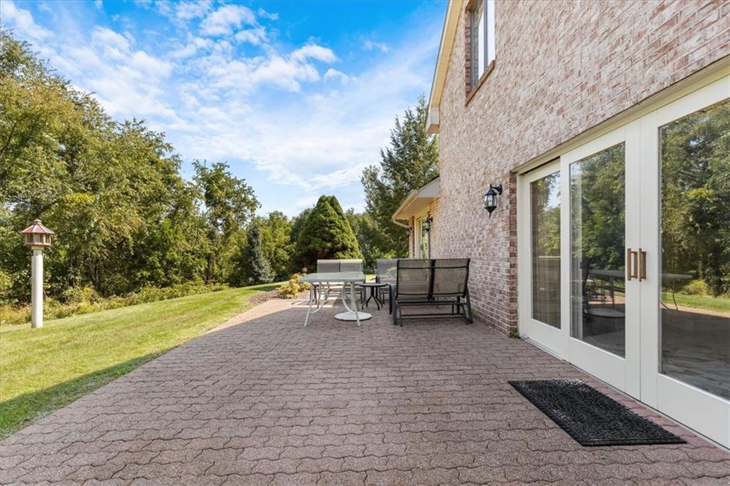 18 Timbercrest Circle Cecil, PA 15321 - Photo 34 of 48 a view of a patio with dining table and chairs with a couches near a garden