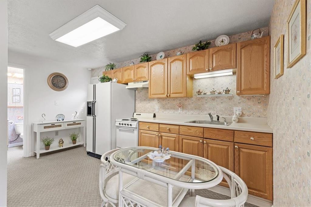 18 Timbercrest Circle Cecil, PA 15321 - Photo 39 of 48 a kitchen with granite countertop a sink and a stove top oven