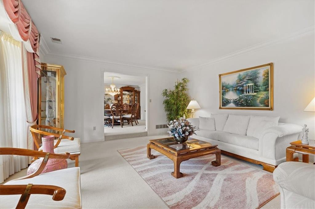 18 Timbercrest Circle Cecil, PA 15321 - Photo 5 of 48 a living room with furniture a rug and a potted plant