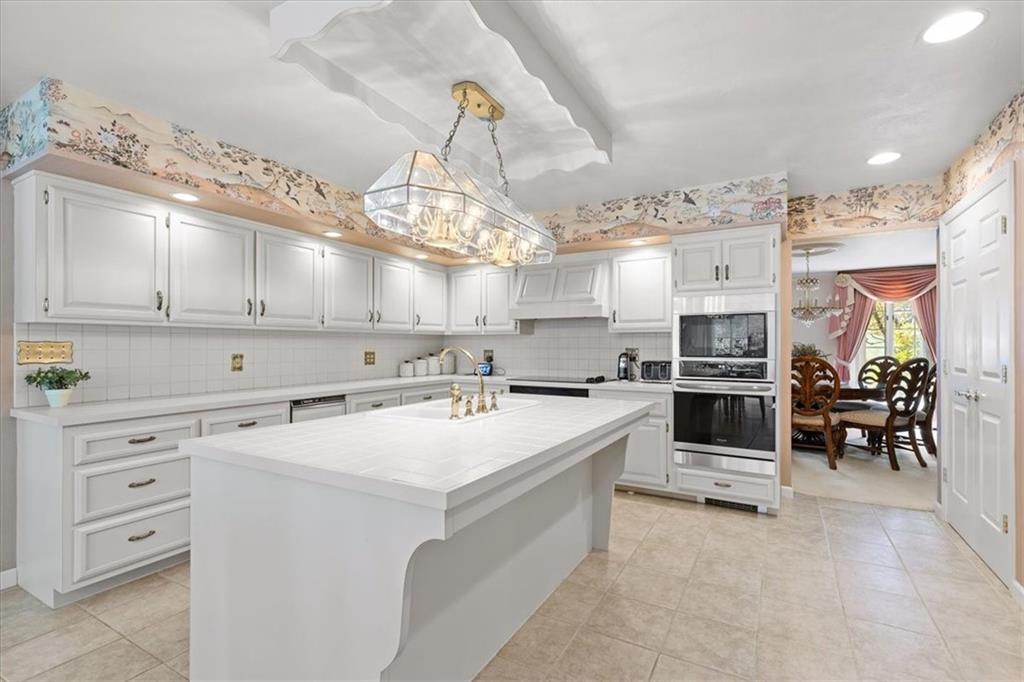 18 Timbercrest Circle Cecil, PA 15321 - Photo 9 of 48 a large white kitchen with lots of counter space a sink and appliances
