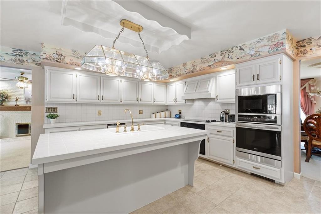 18 Timbercrest Circle Cecil, PA 15321 - Photo 10 of 48 a kitchen with a sink a stove and cabinets