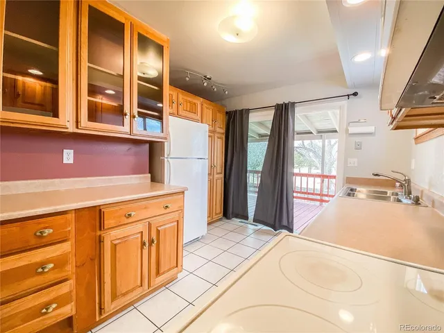 a bedroom with a bed dresser and a windows