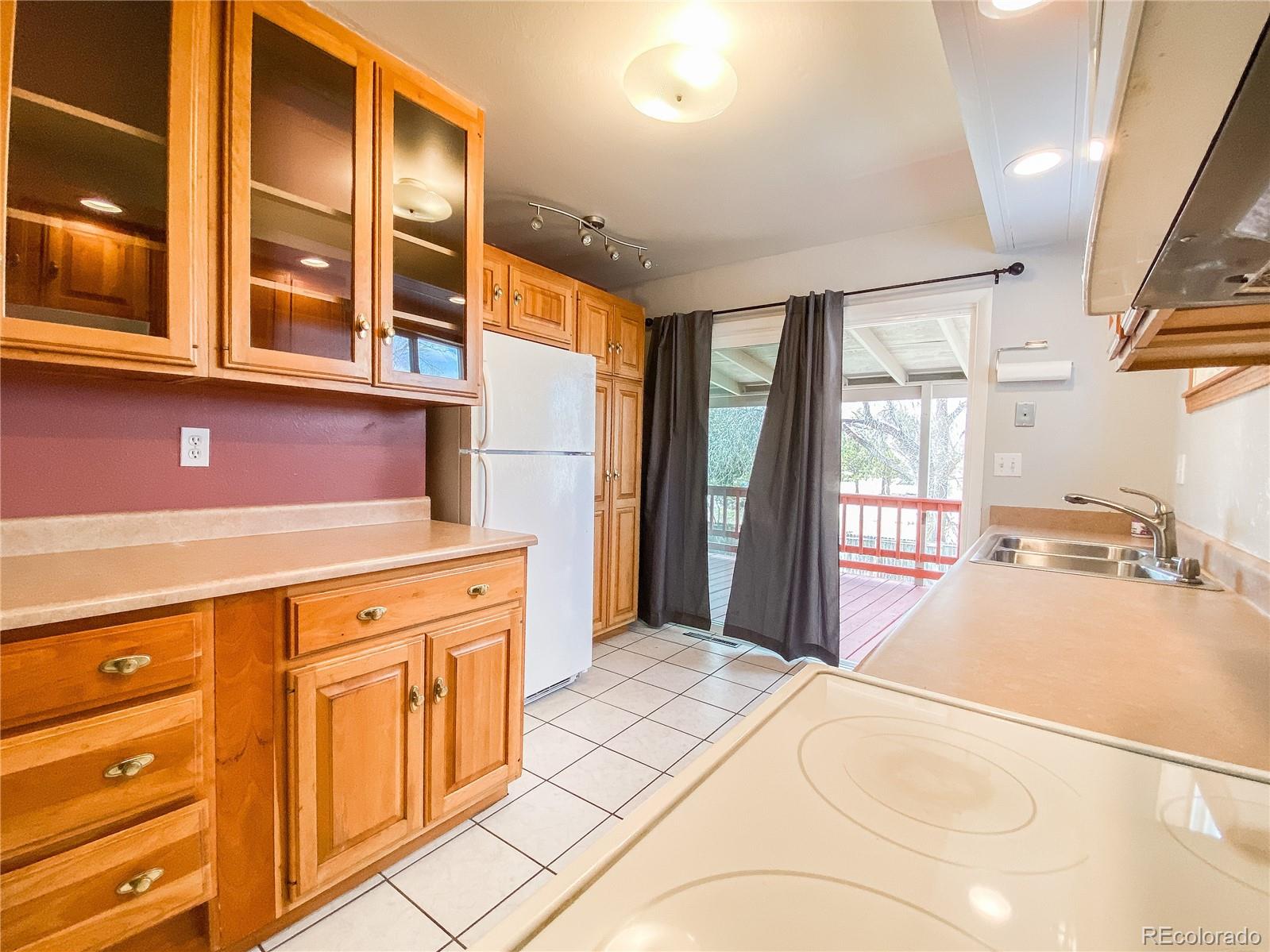 2214 Wold Avenue Colorado Springs, CO 80909 - Photo 12 of 38 a bedroom with a bed dresser and a windows