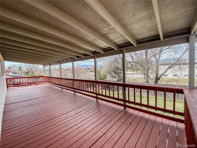 a view of hallway with wooden floor