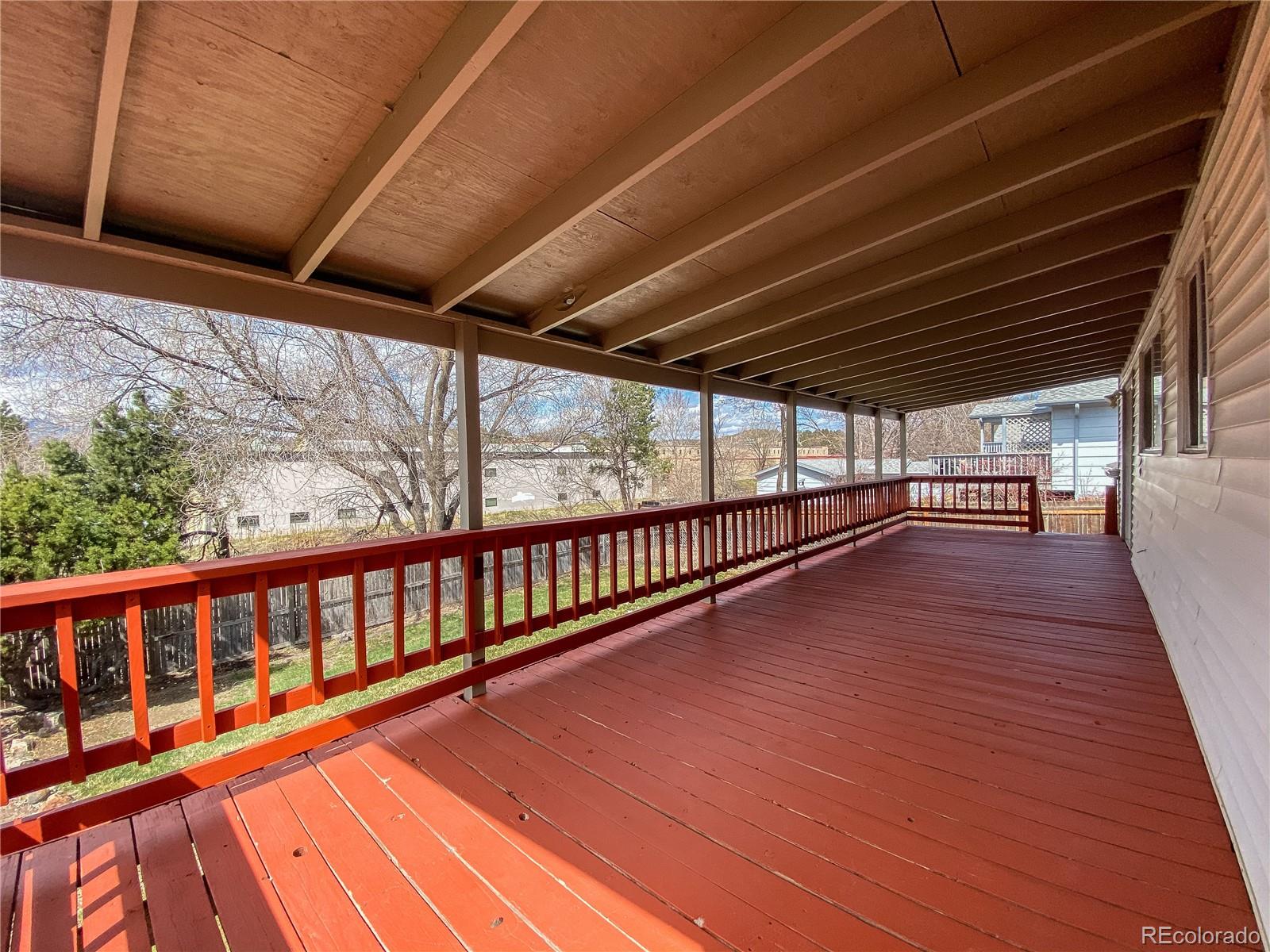 2214 Wold Avenue Colorado Springs, CO 80909 - Photo 17 of 38 a view of balcony with wooden floor