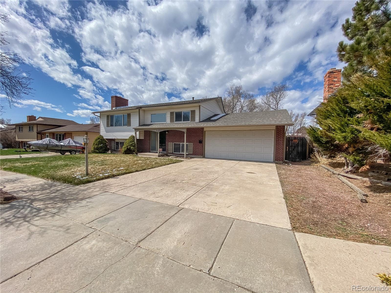 2214 Wold Avenue Colorado Springs, CO 80909 - Photo 2 of 38 a view of house with outdoor entertaining spaces