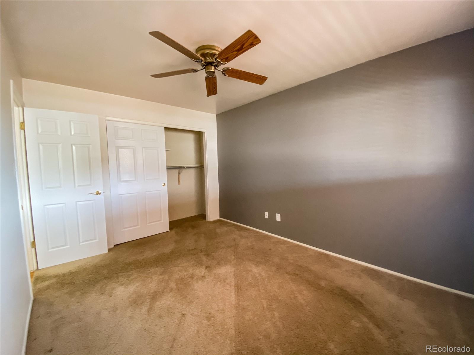 2214 Wold Avenue Colorado Springs, CO 80909 - Photo 21 of 38 an empty room with closet and fan
