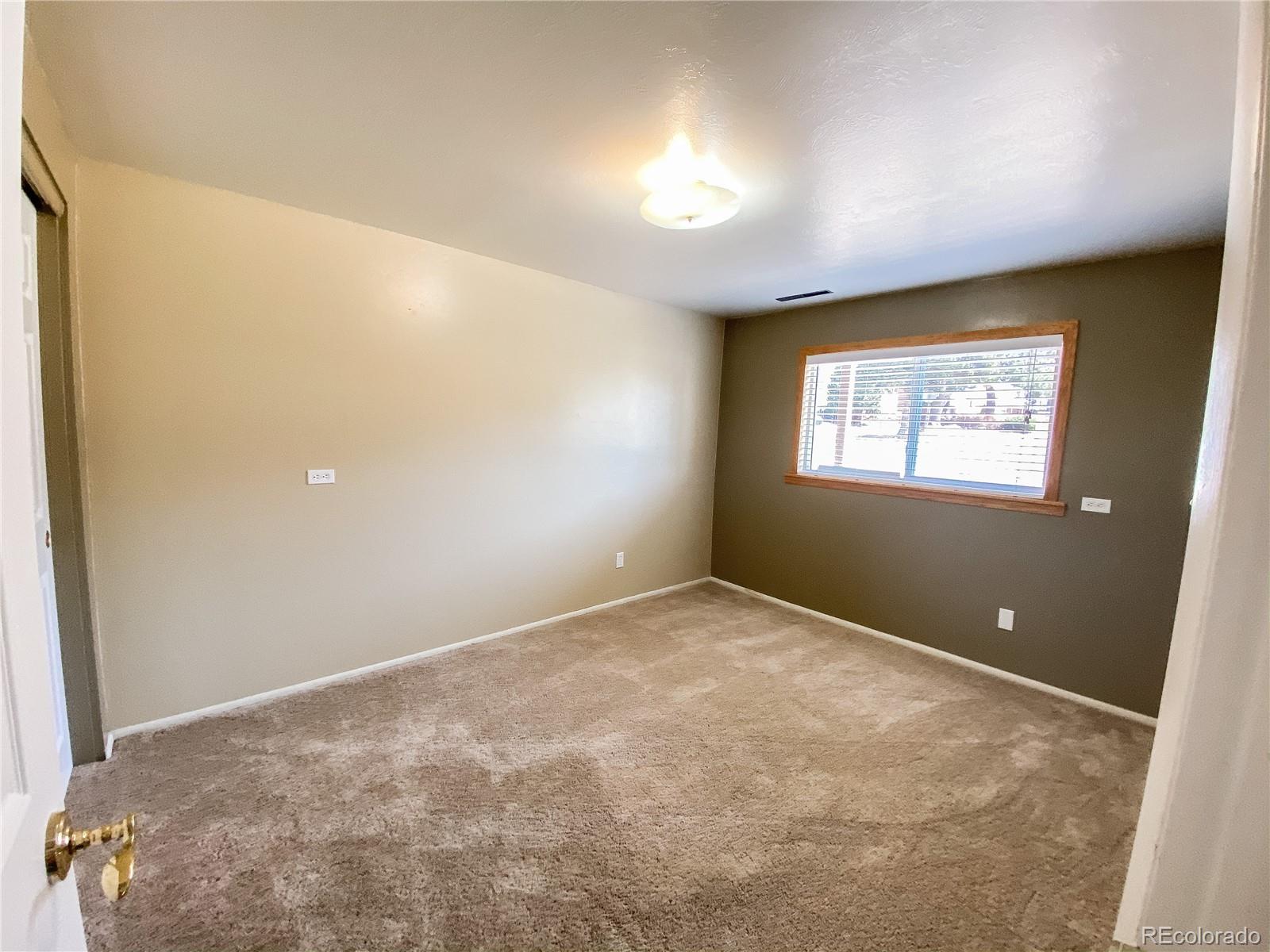 2214 Wold Avenue Colorado Springs, CO 80909 - Photo 33 of 38 a view of an empty room with a window