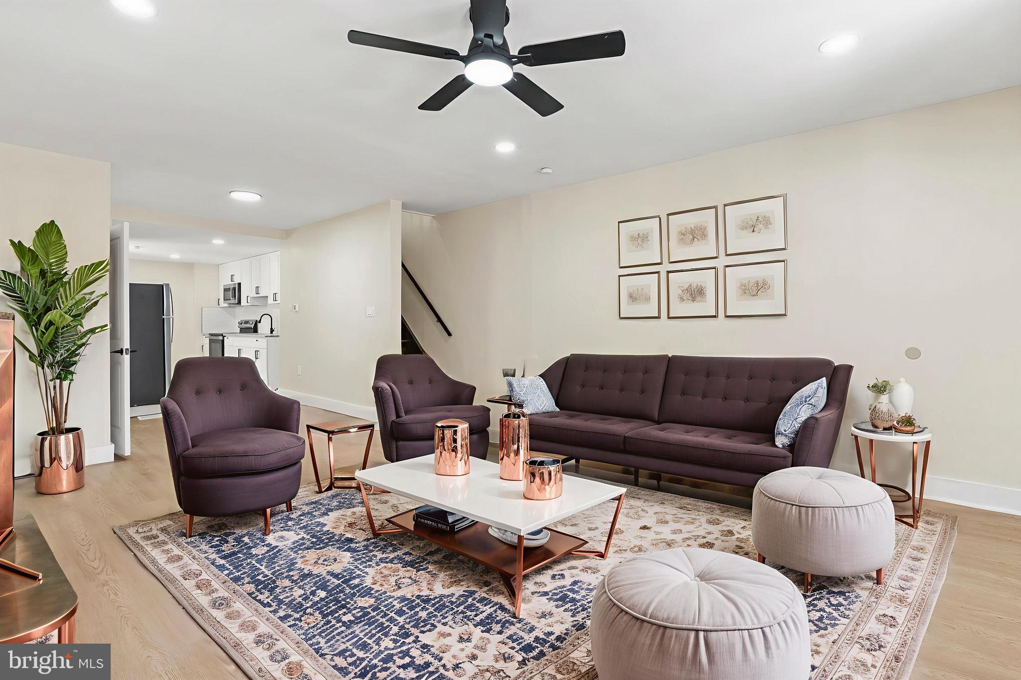 a living room with furniture and a rug
