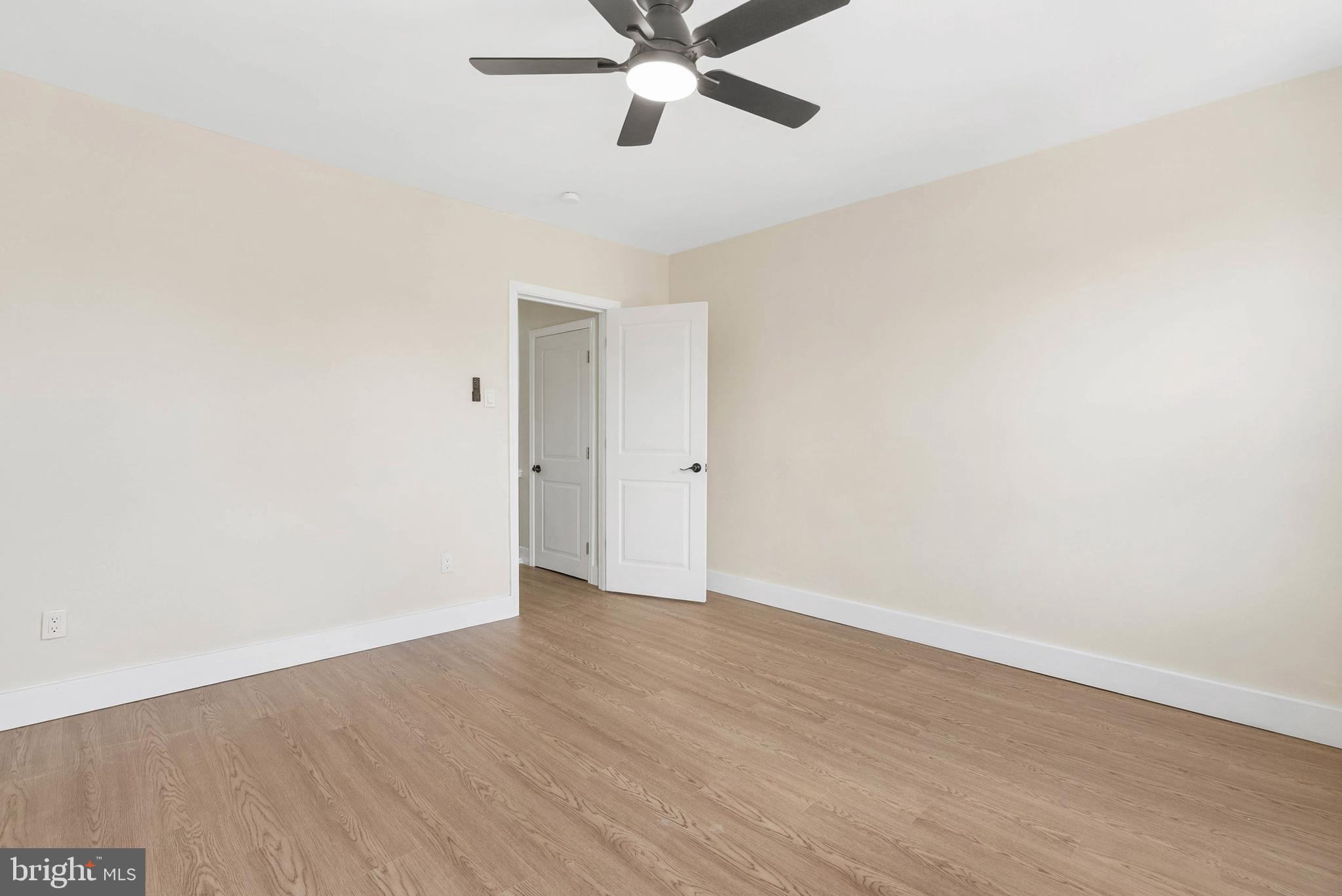 1221 North 50th Street Philadelphia, PA 19131 - Photo 15 of 24 a view of an empty room with wooden floor