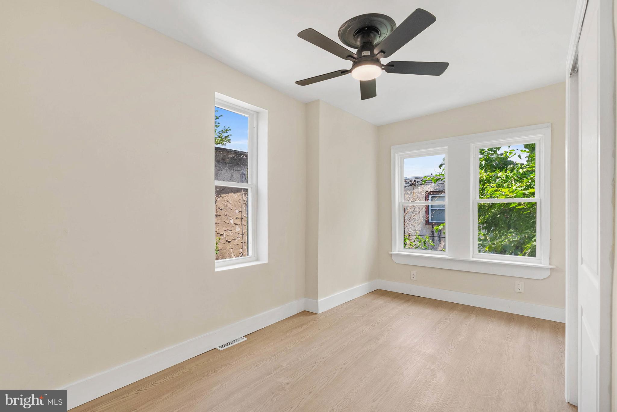 1221 North 50th Street Philadelphia, PA 19131 - Photo 22 of 24 an empty room with window and ceiling fan