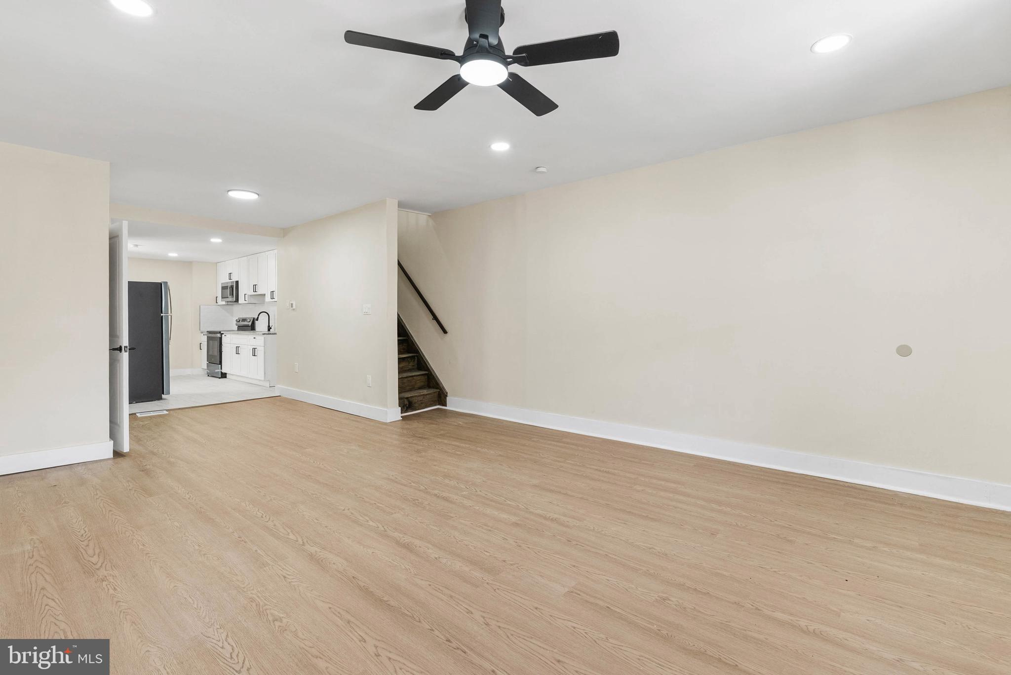 1221 North 50th Street Philadelphia, PA 19131 - Photo 3 of 24 wooden floor in an empty room with a window