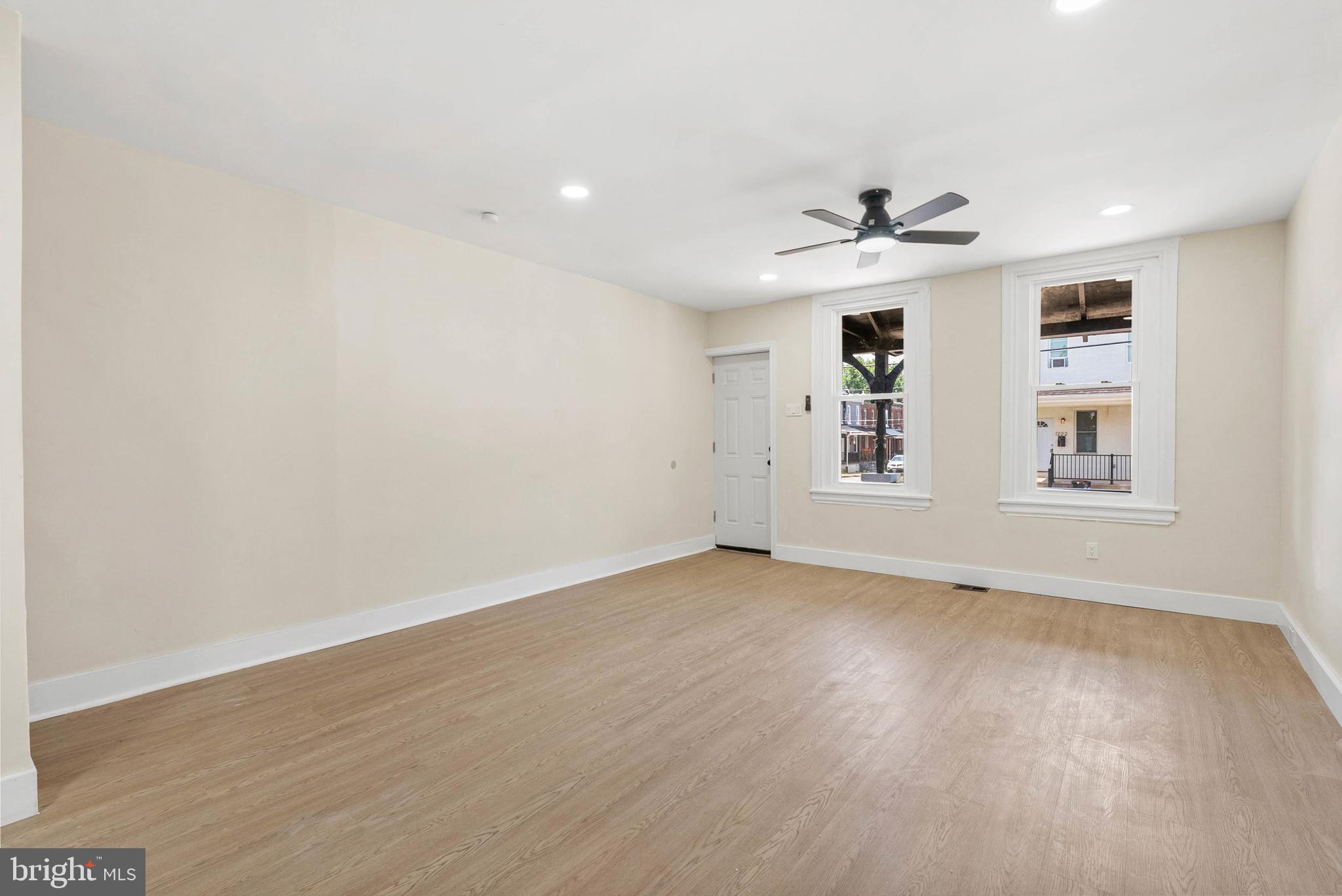 1221 North 50th Street Philadelphia, PA 19131 - Photo 4 of 24 wooden floor in an empty room with a window
