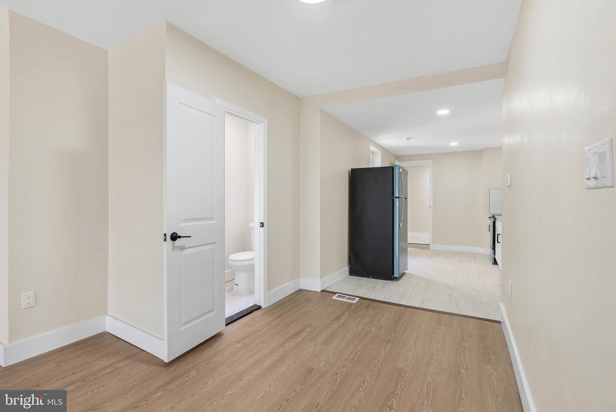 1221 North 50th Street Philadelphia, PA 19131 - Photo 6 of 24 a view of a big room with wooden floor and windows
