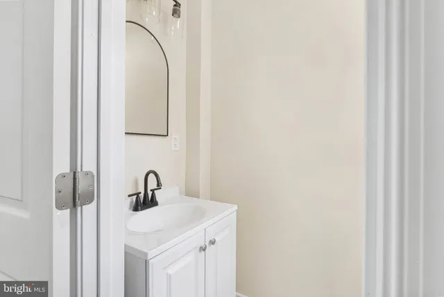 a bathroom with a sink and mirror