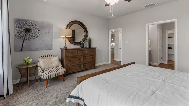 a living room with furniture and kitchen view