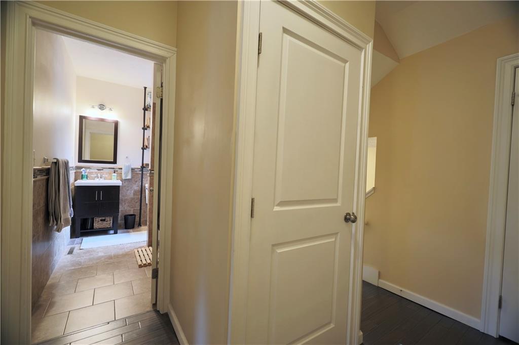 515 Lockhart Street, Unit 3 Pittsburgh, PA 15212 - Photo 21 of 27 a view of a hallway with a livingroom and a bathroom