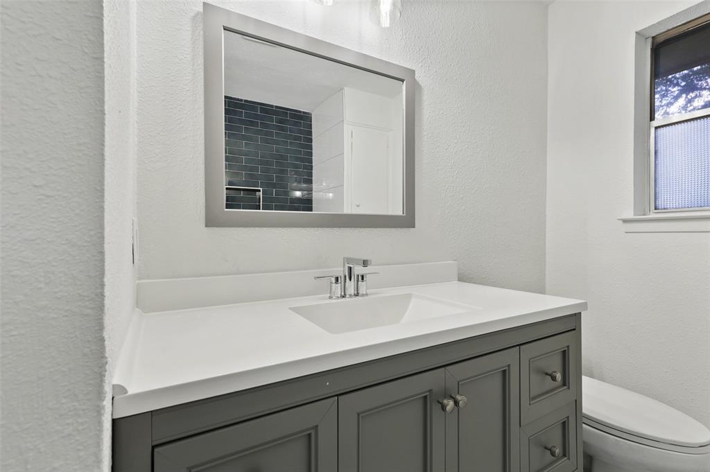 3126 Jubilee Trail Dallas, TX 75229 - Photo 24 of 38 a bathroom with a sink a vanity and a toilet