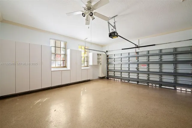 a view of an empty room with windows