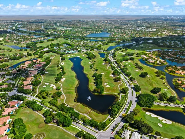 an aerial view of a residential houses with outdoor space