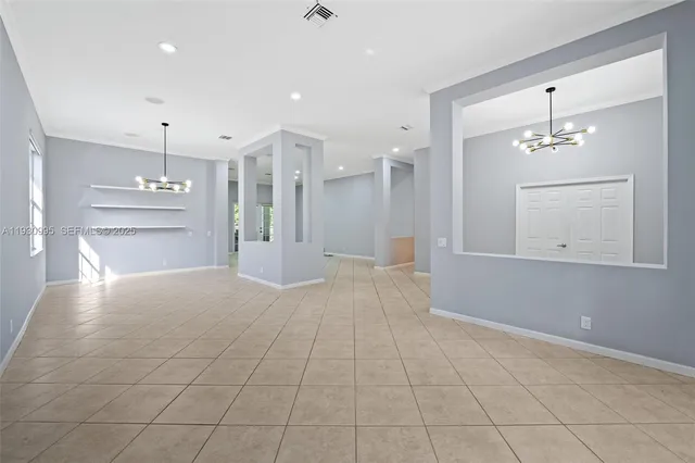 a view of a livingroom with a furniture chandelier