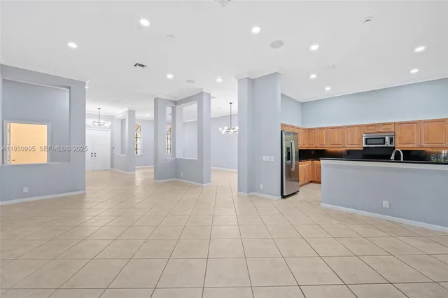 a view of a kitchen with a sink and cabinets