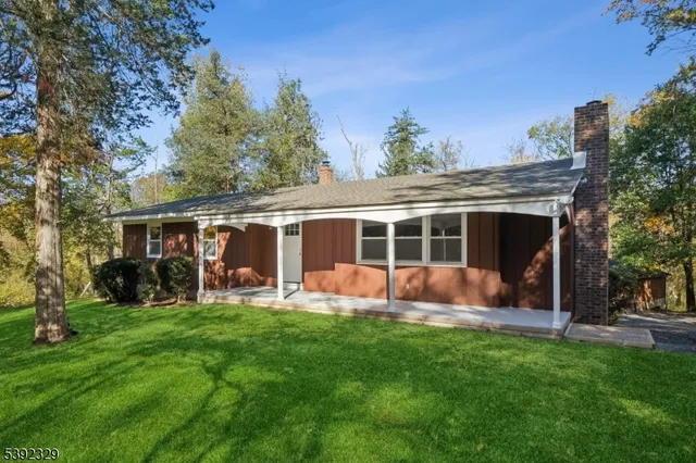 a front view of house with yard and seating area
