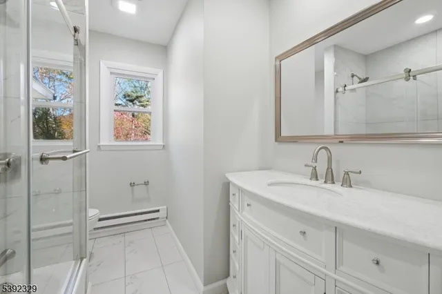 a bathroom with a sink a vanity and a mirror