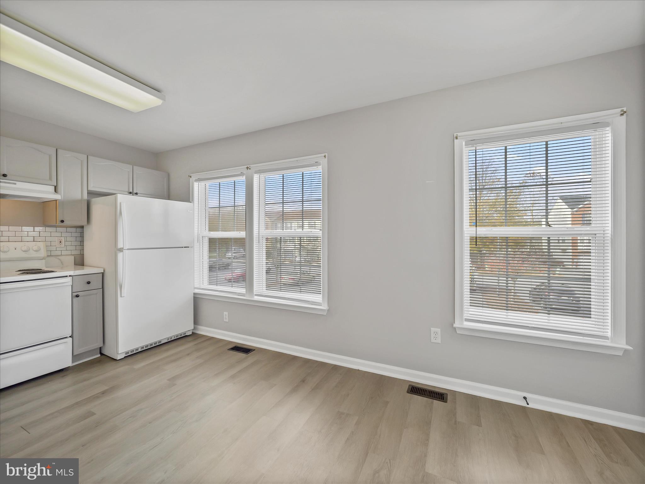 121 Eagles Ridge Smithsburg, MD 21783 - Photo 11 of 33 a view of a kitchen with wooden floor and electronic appliances