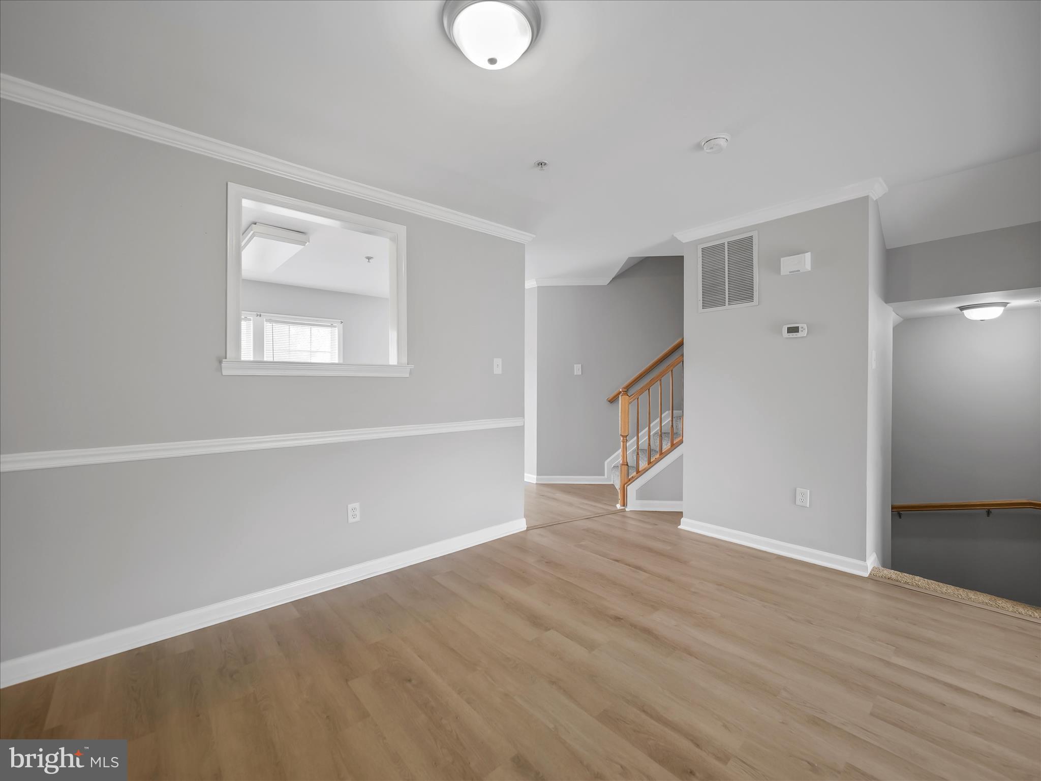 121 Eagles Ridge Smithsburg, MD 21783 - Photo 13 of 33 a view of an empty room with wooden floor and a window