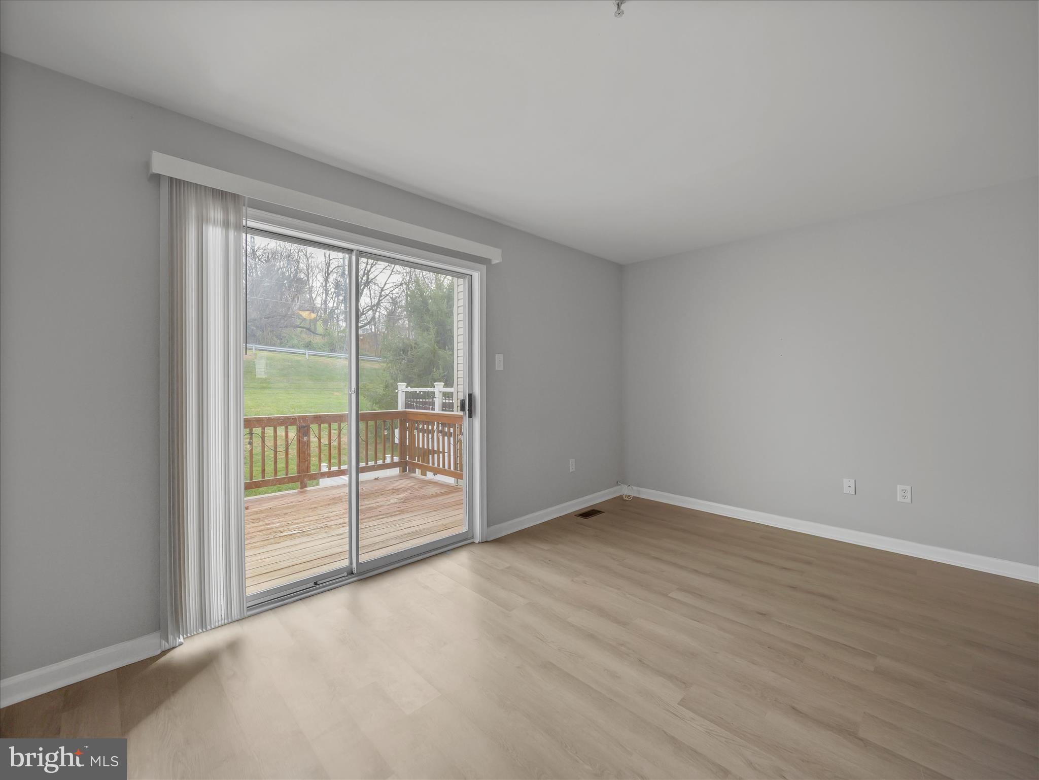 121 Eagles Ridge Smithsburg, MD 21783 - Photo 15 of 33 an empty room with wooden floor and windows