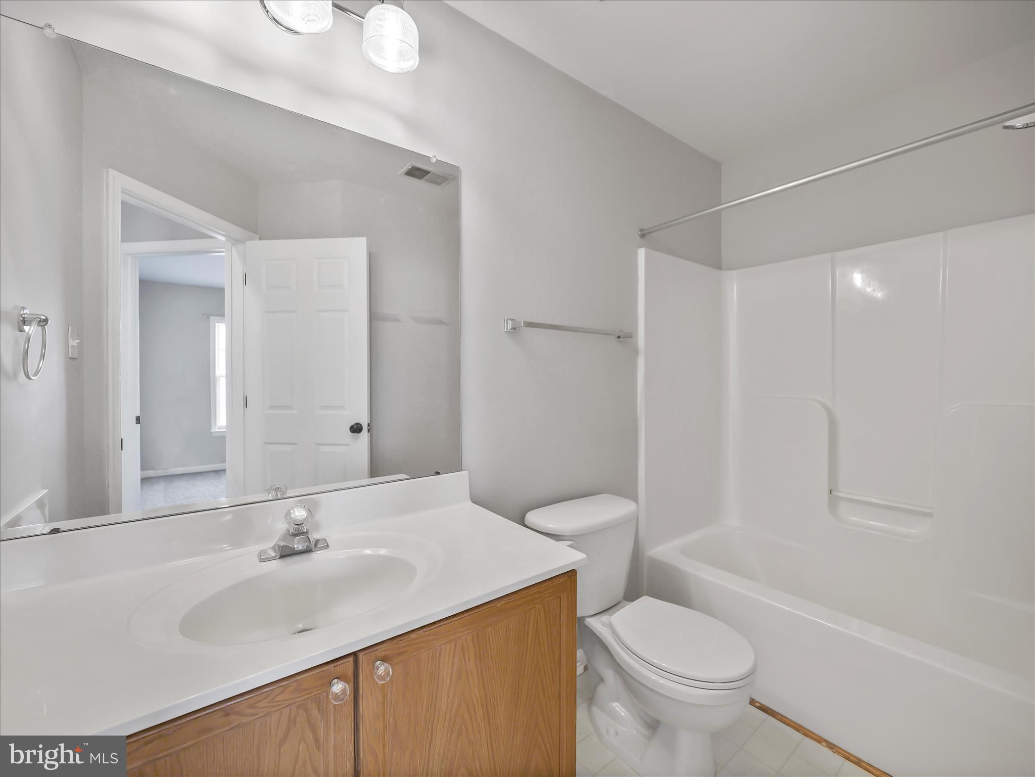 121 Eagles Ridge Smithsburg, MD 21783 - Photo 28 of 33 a bathroom with a sink toilet vanity and shower