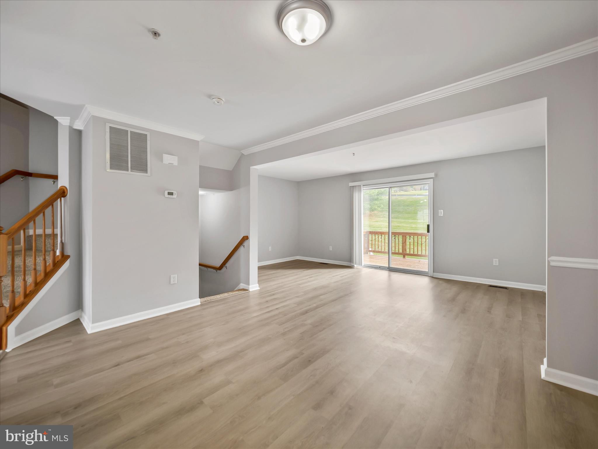 121 Eagles Ridge Smithsburg, MD 21783 - Photo 7 of 33 a view of an empty room with wooden floor and a window