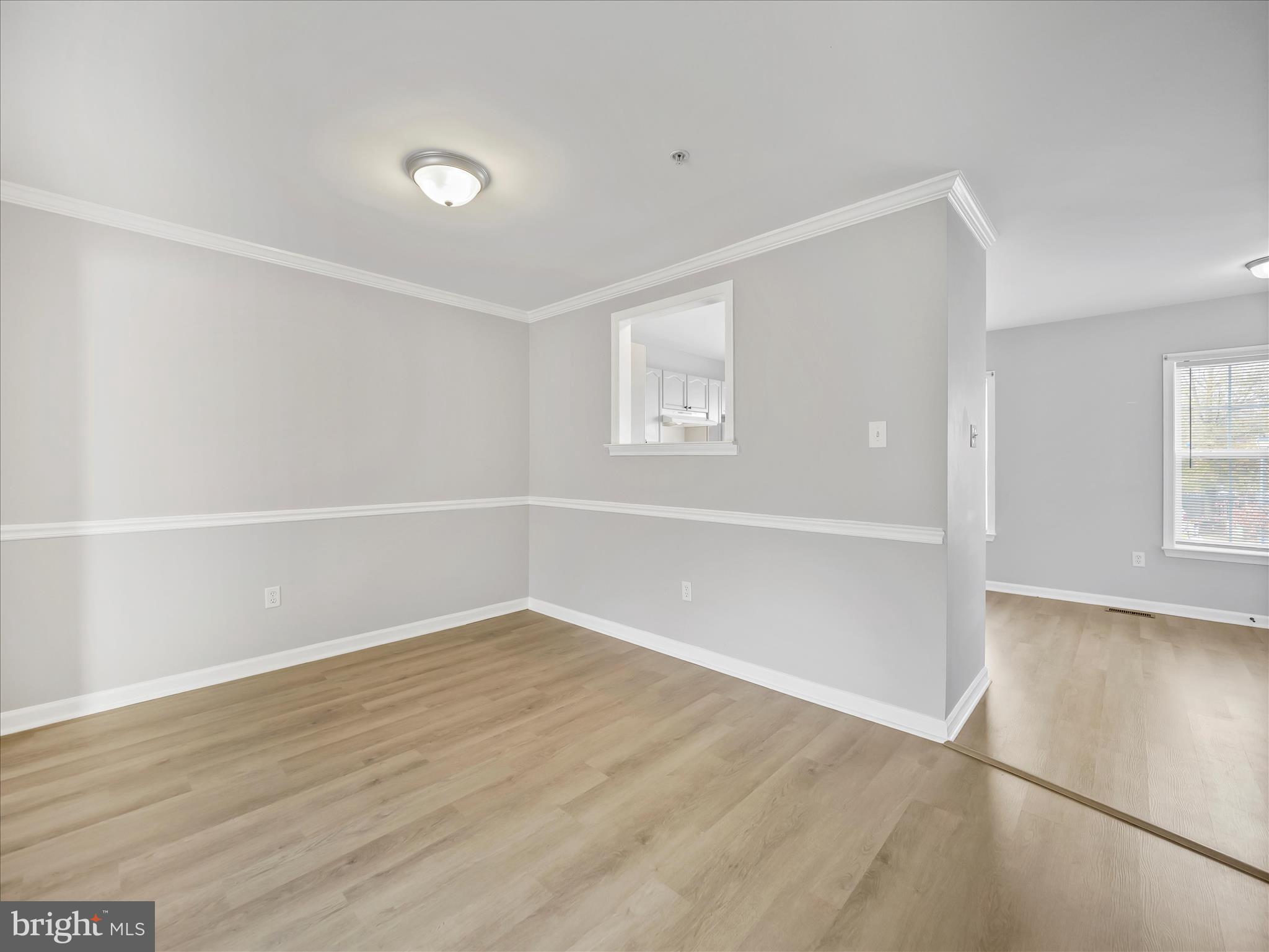 121 Eagles Ridge Smithsburg, MD 21783 - Photo 8 of 33 an empty room with wooden floor and windows