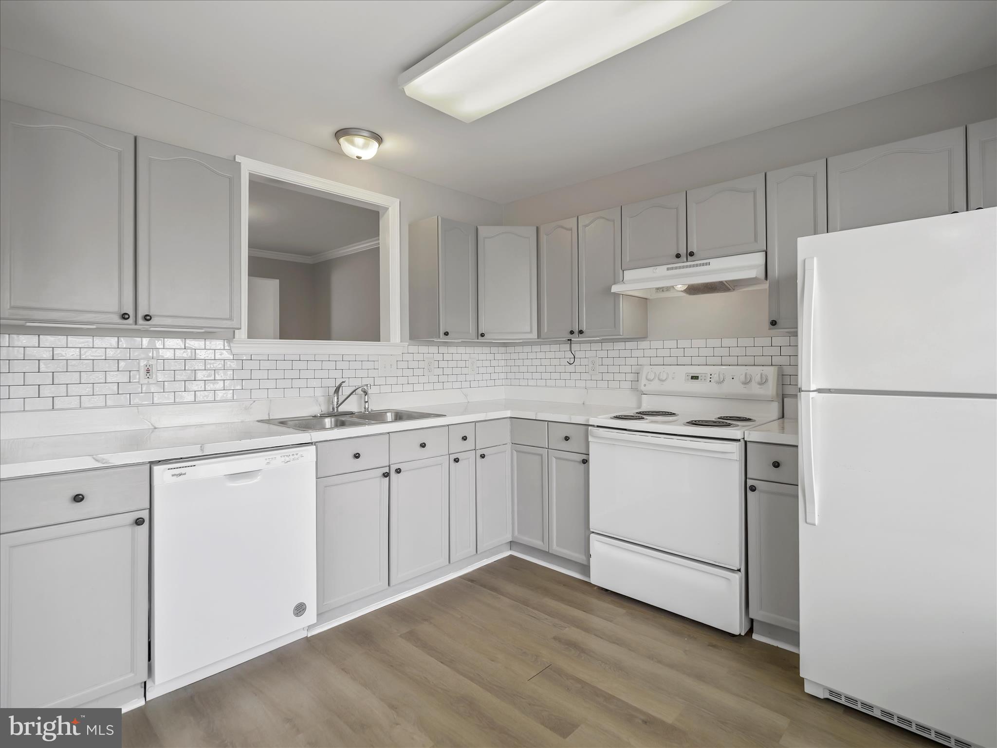 121 Eagles Ridge Smithsburg, MD 21783 - Photo 10 of 33 a kitchen with granite countertop white cabinets and white appliances