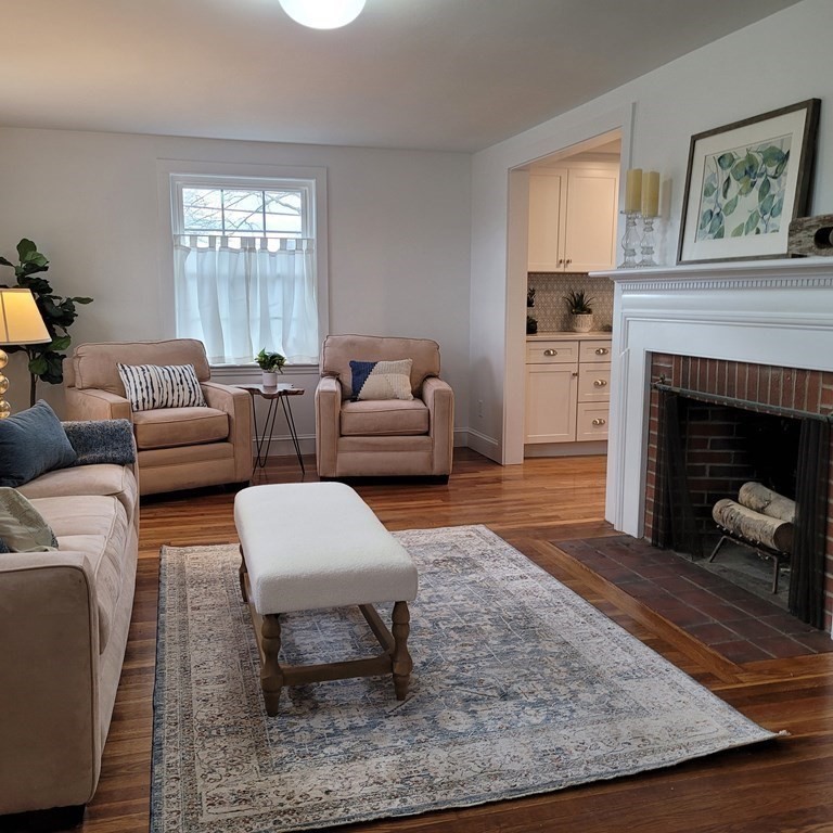 114 Conant Street Danvers, MA 01923 - Photo 15 of 29 a living room with furniture and a fireplace