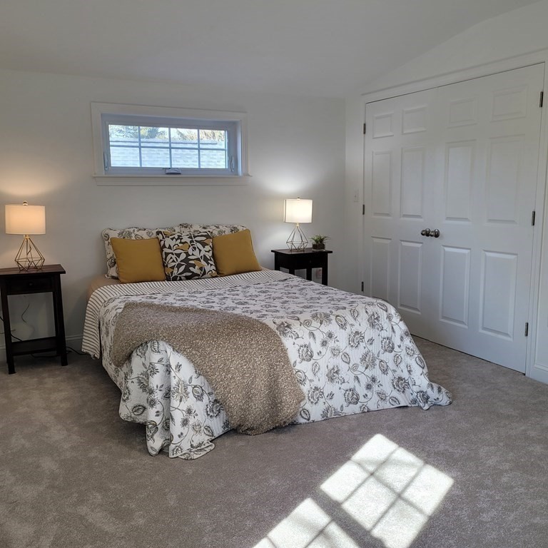 114 Conant Street Danvers, MA 01923 - Photo 21 of 29 a bedroom with a bed and a window