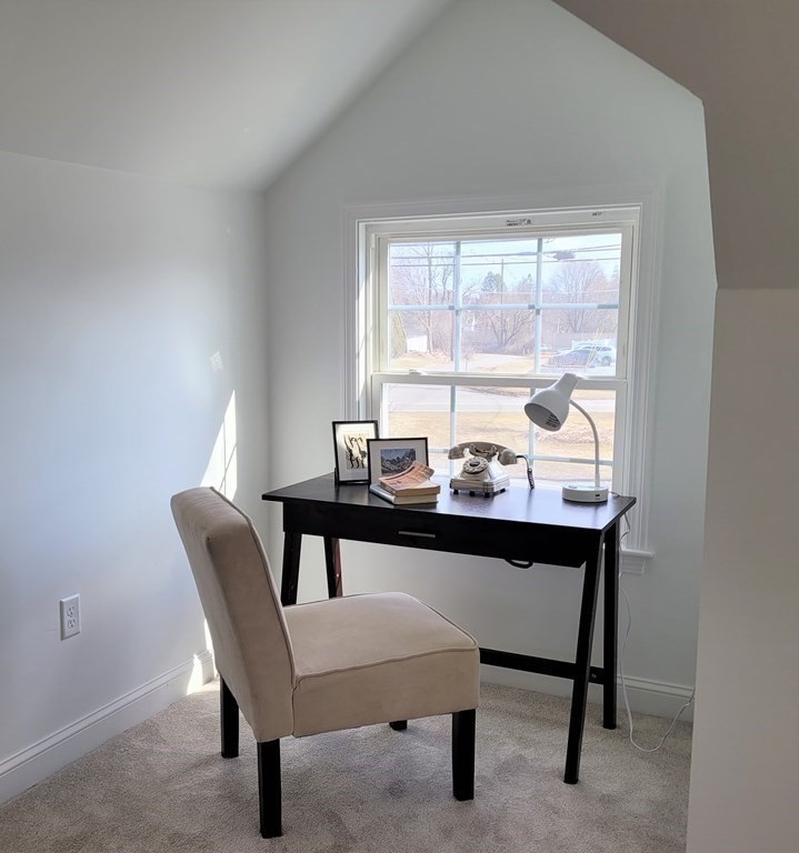 114 Conant Street Danvers, MA 01923 - Photo 22 of 29 a view of a dining room with a table and chairs