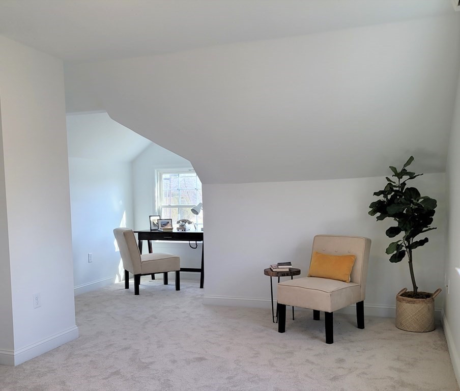 114 Conant Street Danvers, MA 01923 - Photo 23 of 29 a room with furniture and a potted plant