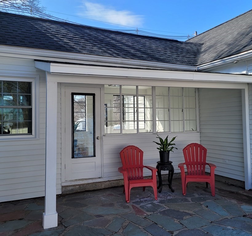 114 Conant Street Danvers, MA 01923 - Photo 3 of 29 a front view of a house with outdoor seating