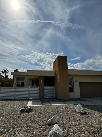 a front view of a house with parking