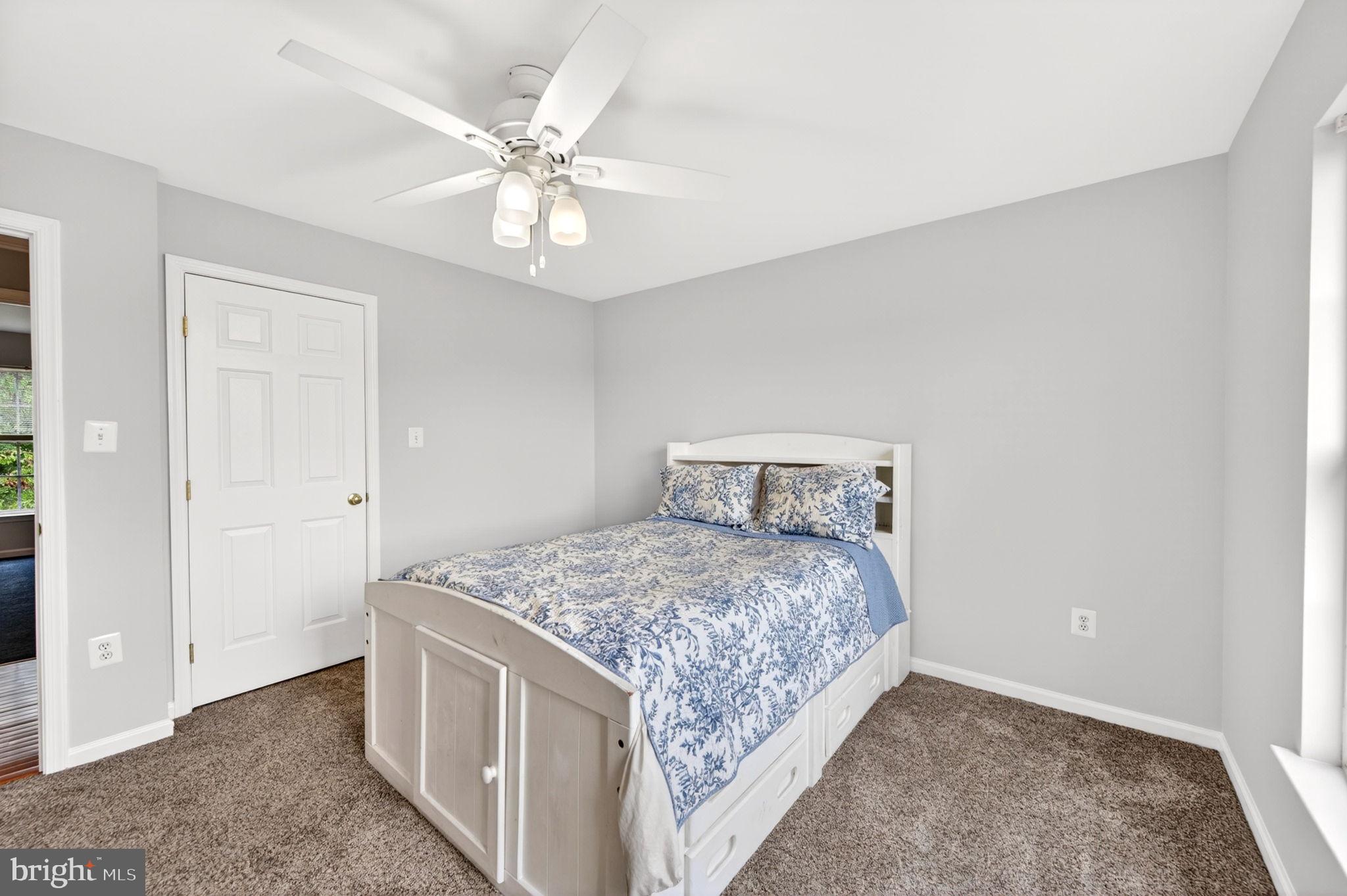 8 North Pointe Terrace Middletown, MD 21769 - Photo 41 of 74 a bedroom with a bed and a chandelier