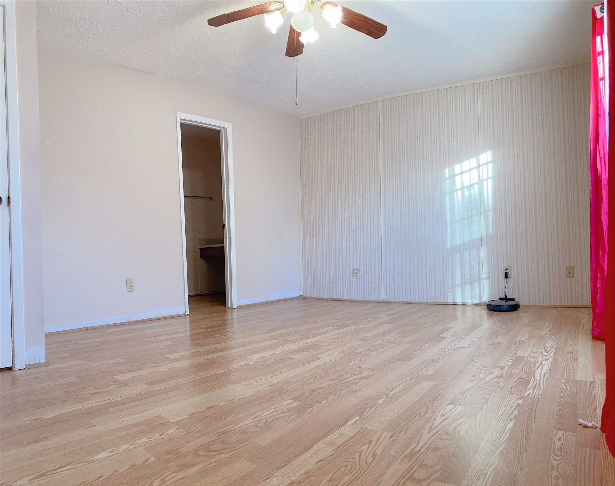 19518 Munsey Court Katy, TX 77449 - Photo 25 of 45 an empty room with wooden floor chandelier fan and windows