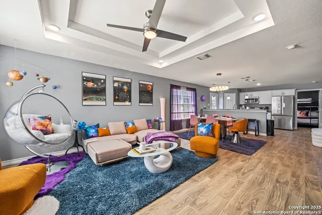 a living room with furniture and a mirror