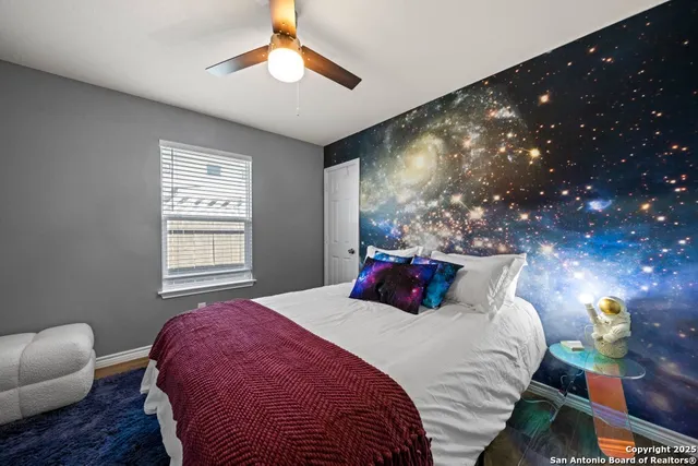 a bedroom with a bed and a couch