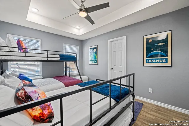 a living room with furniture a rug and a window